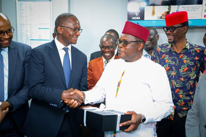 NCBA Group Executive Director and CFO, David Abwoga with Governor Kenneth Lusaka during the opening of NCBA branch in Chwele.